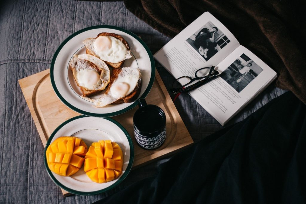 Breakfast in bed with a book