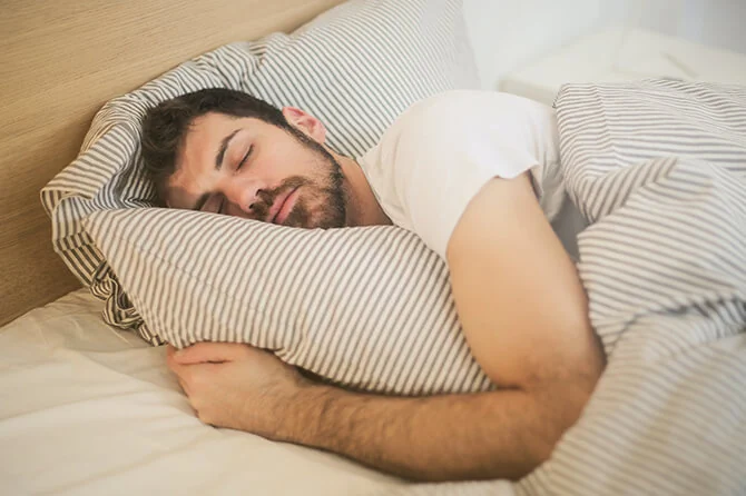 Man sleeping peacefully in bed