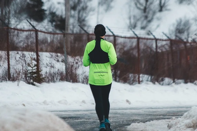 Woman running on winter’s day