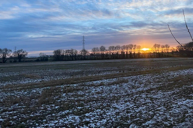 a sunset on a winter day