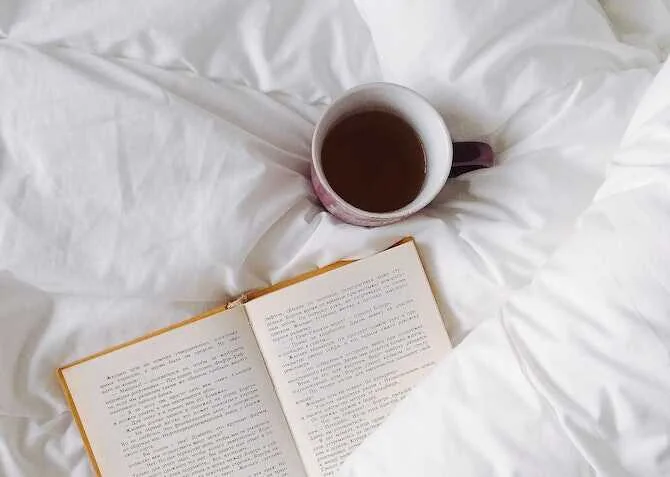 duvet day with hot drink and book