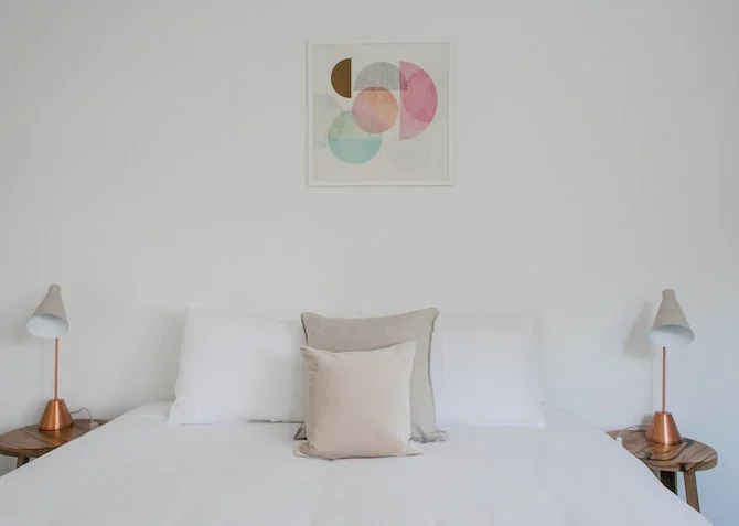 Crisp white bedding with plush pillows and duvet