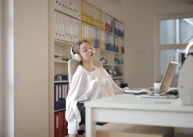 woman sleeping in her office doing strategic recharging