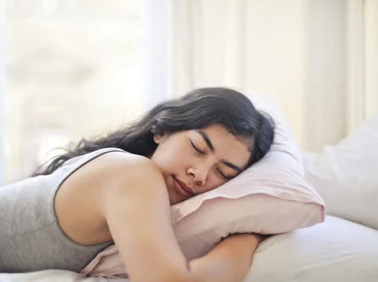 woman laying on a topper