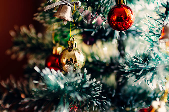 Christmas tree decorated with red and gold baubles