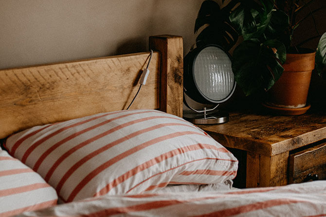 Cosy bedroom with plump pillows and bedding