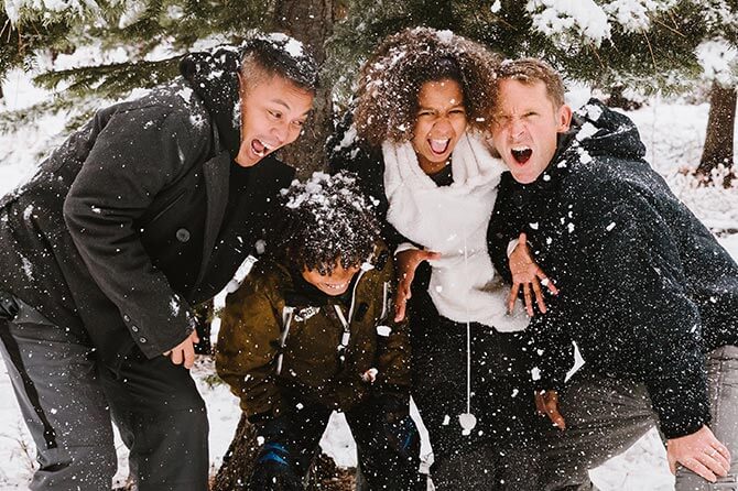 A family playing in the snow
