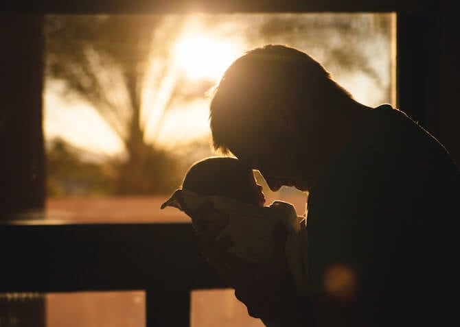 dad and baby at sunset