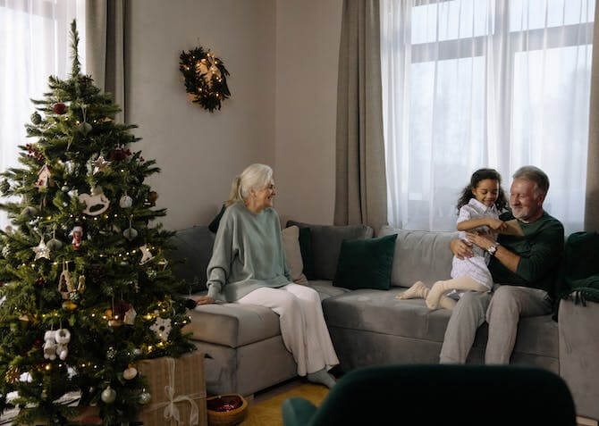 elderly couple with grandchild at Christmas