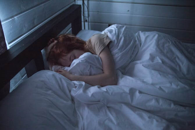 a red-haired woman sleeping soundly