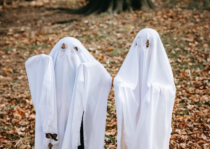 two kids dressed up as ghosts