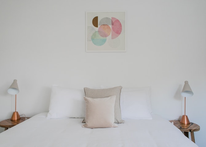 Crisp white bedding with plush pillows and duvet