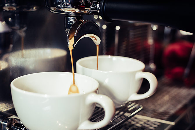 Coffee being poured into cups
