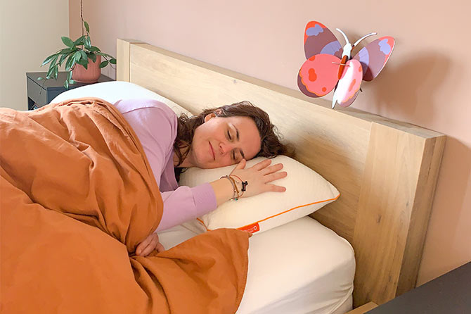Person sleeping soundly in bed